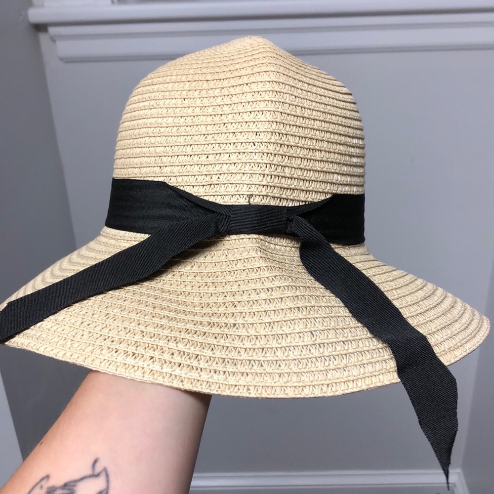 Straw hat with black ribbon tie